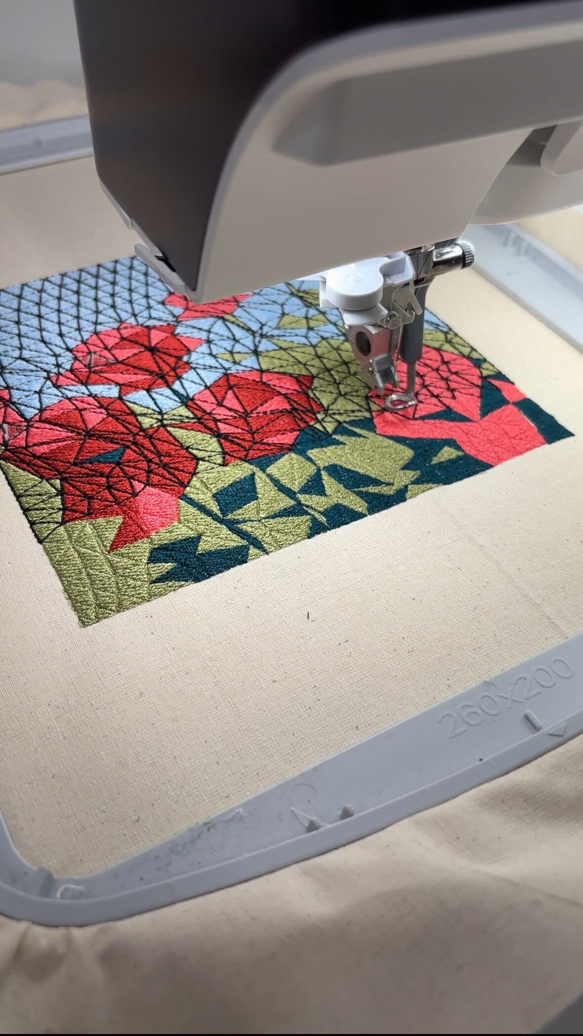 Professional embroidery machine creating a custom design
