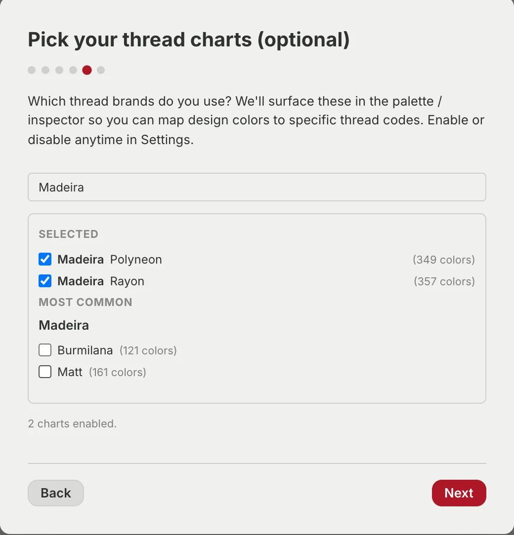 The thread chart step with Madeira typed into the search box. Madeira Polyneon, 349 colours, and Madeira Rayon, 357 colours, are ticked under a Selected heading, with Burmilana and Matt listed unticked below and a line reading 2 charts enabled.